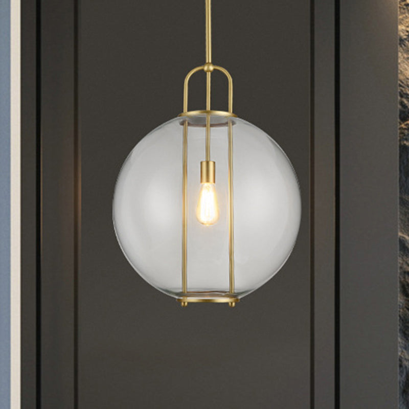 Clear Glass Hanging Lamp With Postmodern Globe Design - 1-Light Pendant In Brass For Bedside