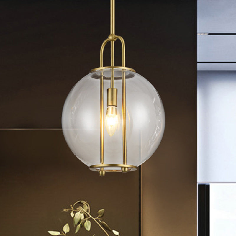 Clear Glass Hanging Lamp With Postmodern Globe Design - 1-Light Pendant In Brass For Bedside