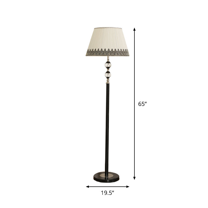 Modernist Black Floor Lamp With Clear Crystal Globe Base And Barrel Fabric Shade