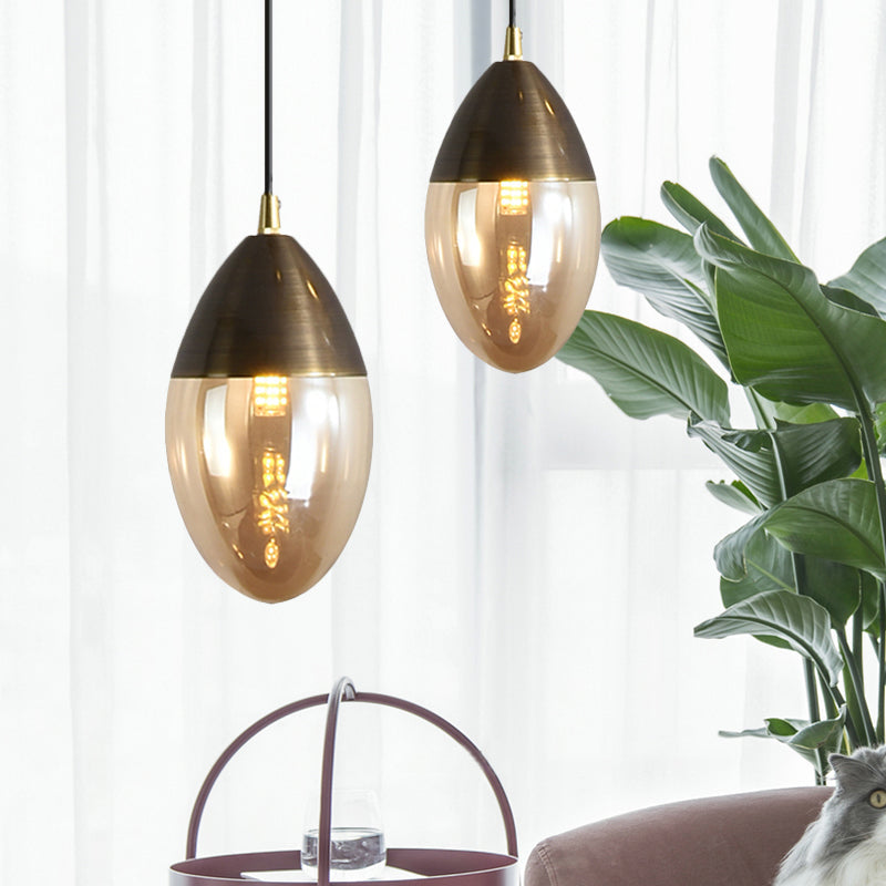 Sleek Postmodern Ellipsoid Pendant Light - Clear/Amber Glass LED, Ideal for Dining Room Ceiling