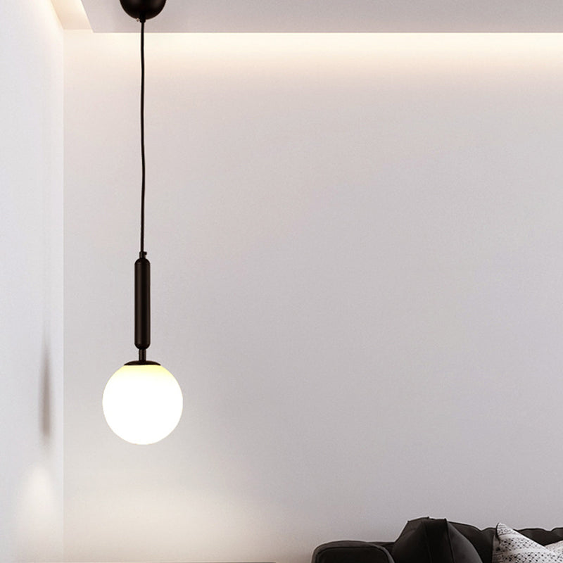 Suspension boule postmoderne noire/dorée avec verre transparent/blanc - Éclairage de chambre à coucher