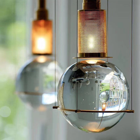 Postmodern Clear Glass Ball Pendant Ceiling Light with Gold Mesh Top - Single Hanging Lamp Kit