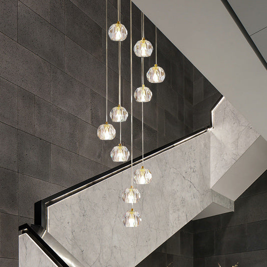 Suspension en verre transparent avec plusieurs pendules dorées et design en spirale - Éclairage d'escalier moderne