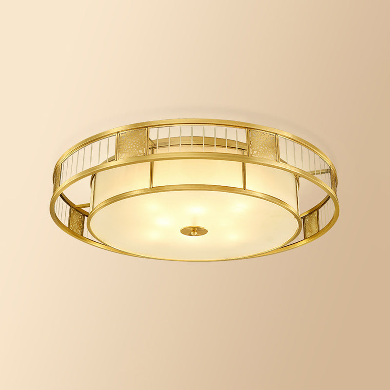 Classic Cream Glass Drum Flush Mount Light With Gold Finish And Cutout Metal Decor - Ideal For