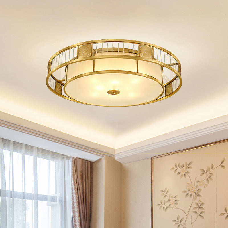 Classic Cream Glass Drum Flush Mount Light With Gold Finish And Cutout Metal Decor - Ideal For