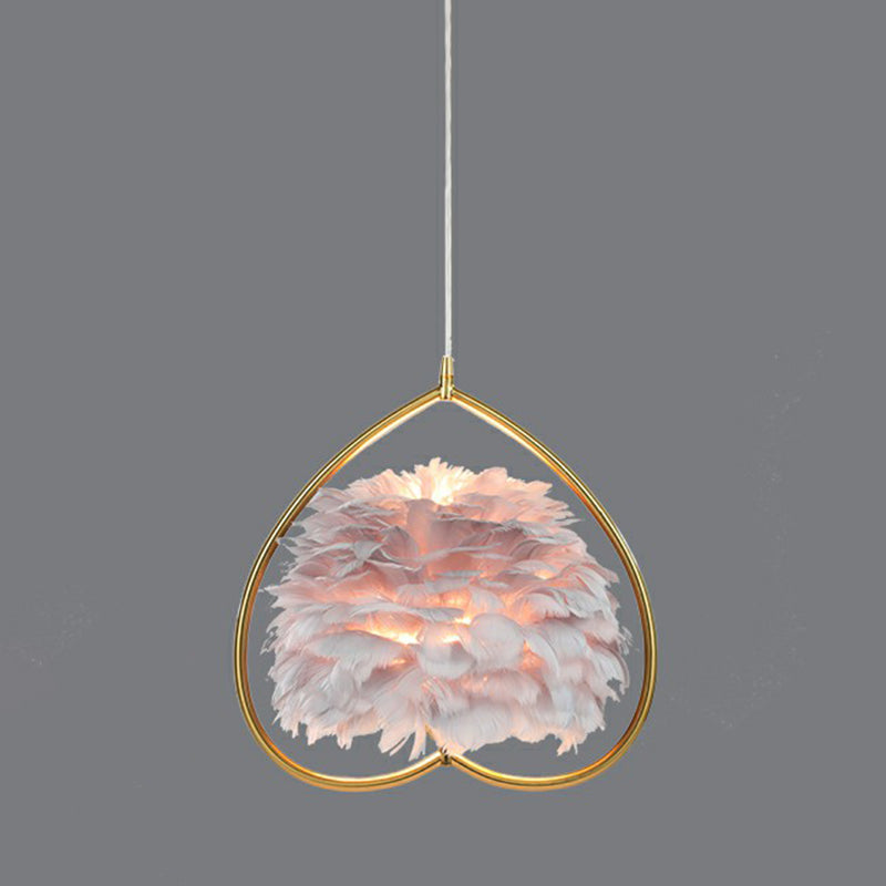 Contemporary Gold Pendant Ceiling Light with Metallic Heart Suspension and Feather Decoration
