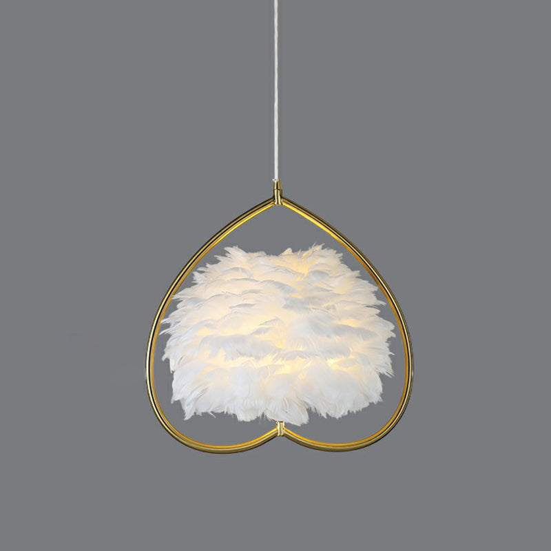 Contemporary Gold Pendant Ceiling Light with Metallic Heart Suspension and Feather Decoration