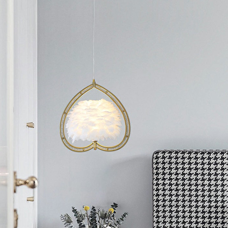 Contemporary Gold Pendant Ceiling Light with Metallic Heart Suspension and Feather Decoration