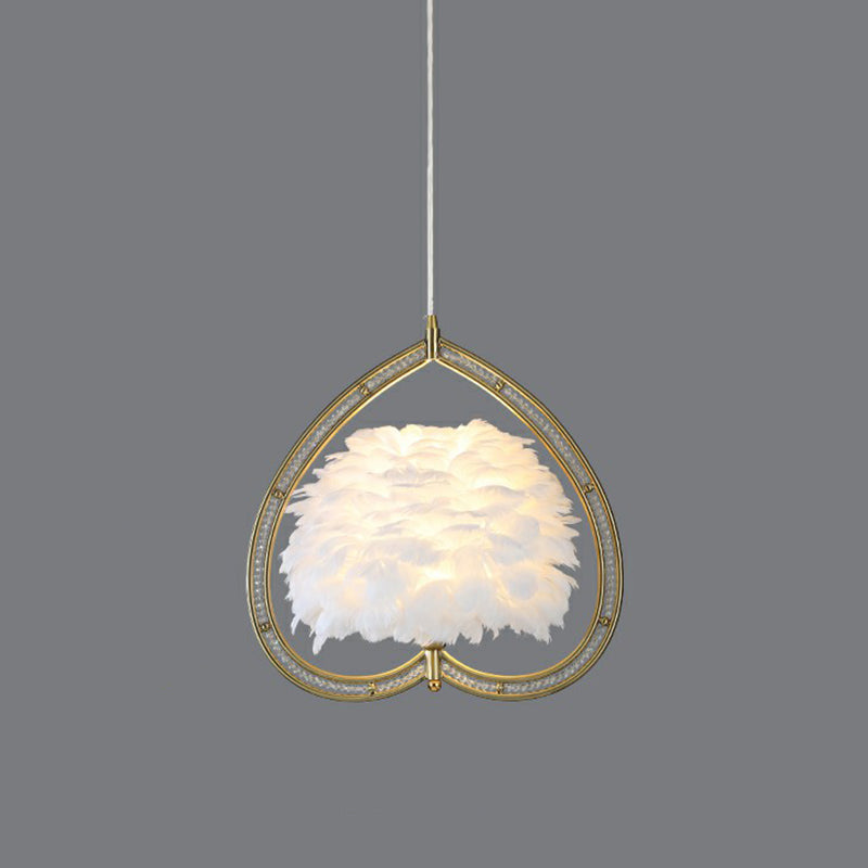 Contemporary Gold Pendant Ceiling Light with Metallic Heart Suspension and Feather Decoration