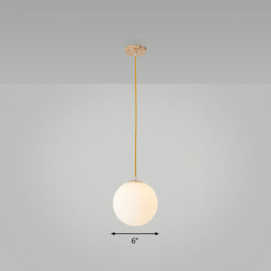 Sleek White Glass Pendant Light for Minimalist Table Settings