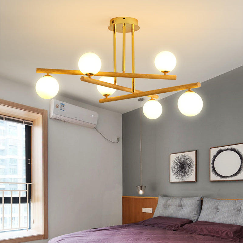 Lustre sphérique en bois avec abat-jour en verre opale pour un éclairage de chambre minimaliste