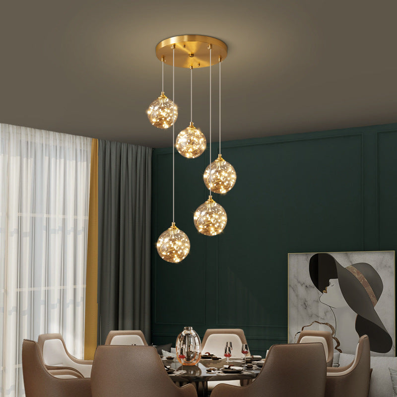 Lampe à suspension LED en verre ambré nordique avec finition en laiton et design étoilé pour chambre à coucher