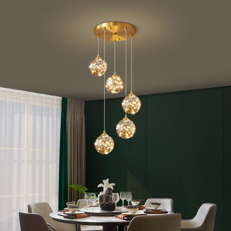Lampe à suspension LED en verre ambré nordique avec finition en laiton et design étoilé pour chambre à coucher