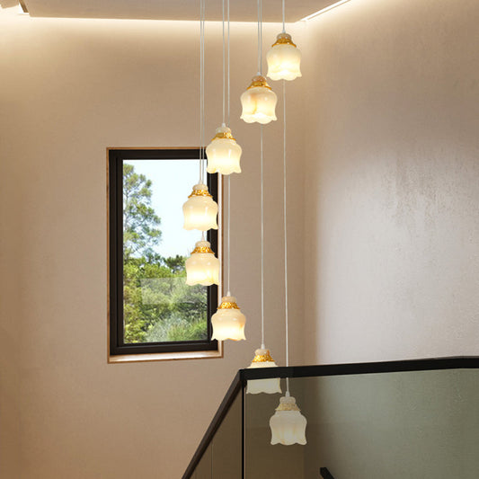 Modern 8-Light White Glass Floral Pendant Lamp with Gold Stair Hanging Design
