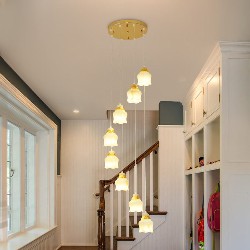 Modern 8-Light White Glass Floral Pendant Lamp with Gold Stair Hanging Design