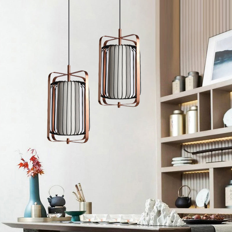 Modernist Metal 1-Light Rose Gold Pendant With Black Cage And White Fabric Shade