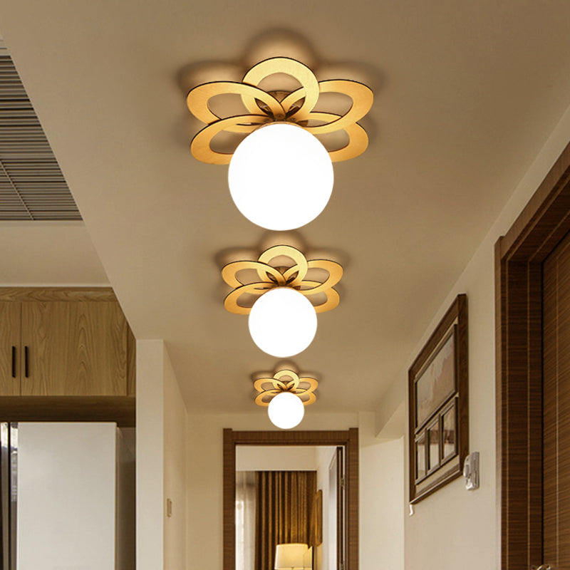 Frosted Glass Orb Ceiling Light with Modern Gold Flower Canopy