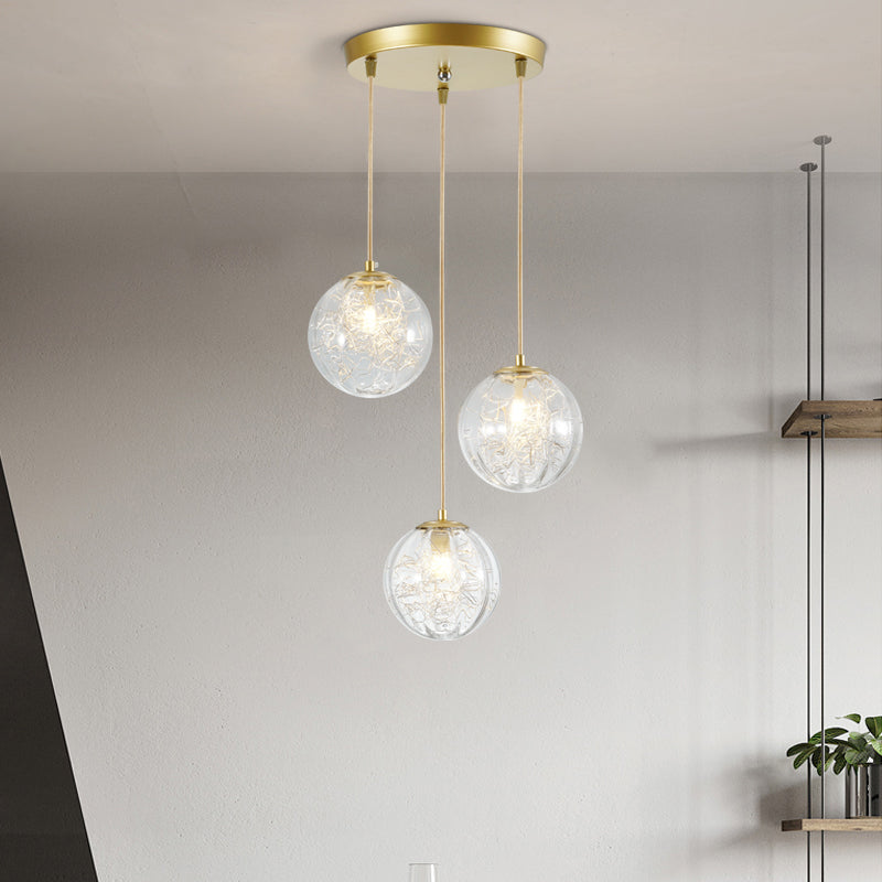 Suspension boule citrouille décorative en métal doré avec verre transparent - Lampe suspendue minimaliste à 3 lumières pour cafés