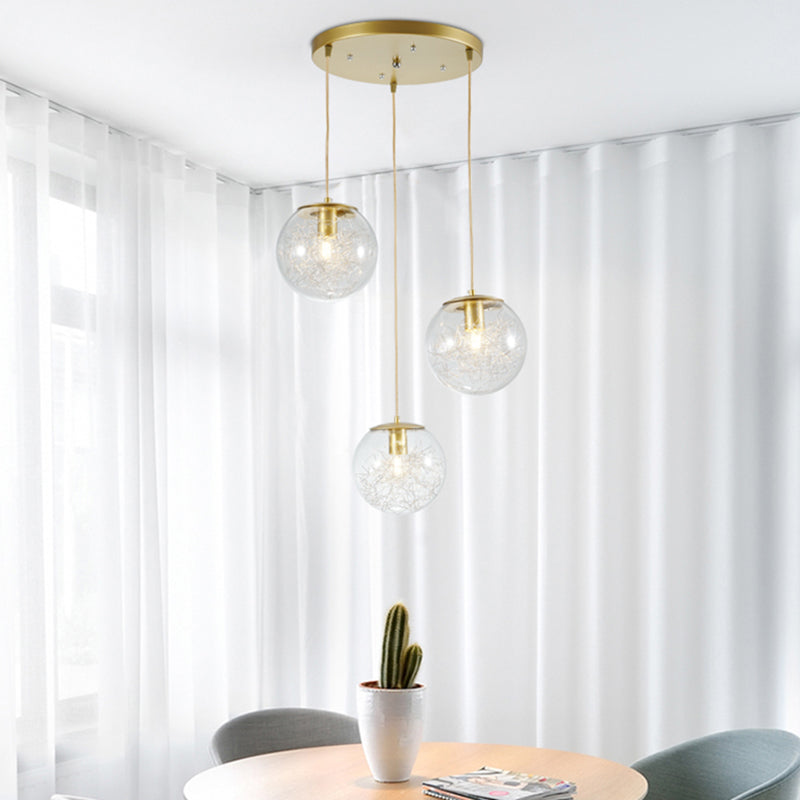 Suspension boule citrouille décorative en métal doré avec verre transparent - Lampe suspendue minimaliste à 3 lumières pour cafés