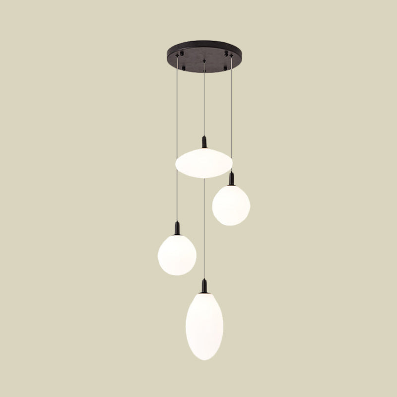 Lampe à suspension minimaliste dorée/noire avec 4 lumières et verre crème
 ou
 "Lampe suspendue minimaliste à 4 lumières en or/noir avec verre crème