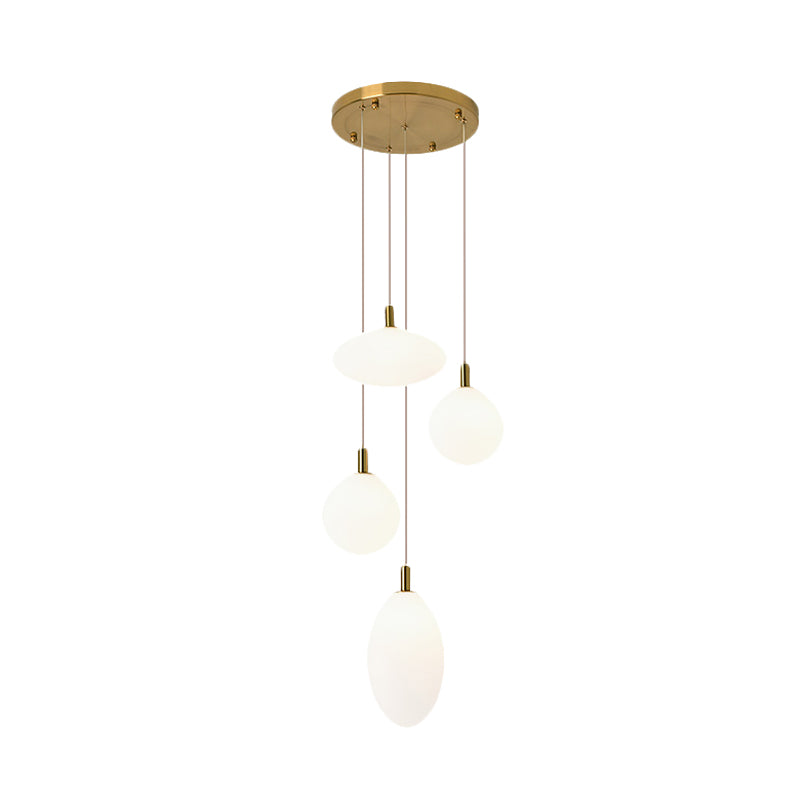 Lampe à suspension minimaliste dorée/noire avec 4 lumières et verre crème
 ou
 "Lampe suspendue minimaliste à 4 lumières en or/noir avec verre crème
