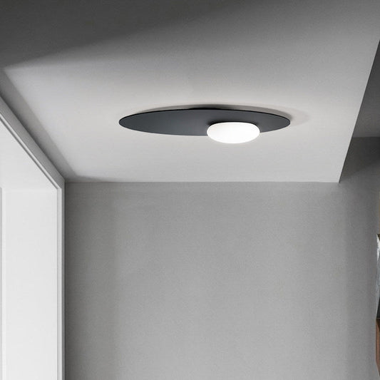 Modern Cream Glass Flush Mount Lamp: Designer 1-Light Ceiling Fixture with Black/Brass Disk Top