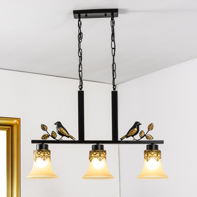 Black Island Pendant With 3 Tan Glass Shades And Bird Deco - Traditional Dining Room Ceiling Light