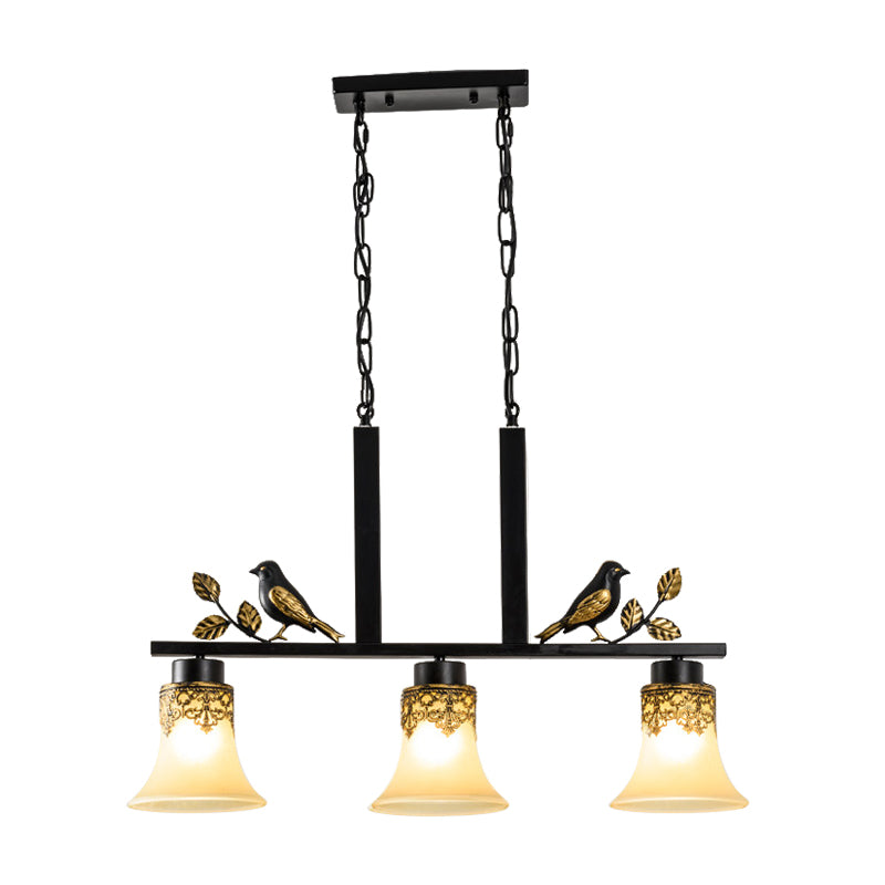 Black Island Pendant With 3 Tan Glass Shades And Bird Deco - Traditional Dining Room Ceiling Light